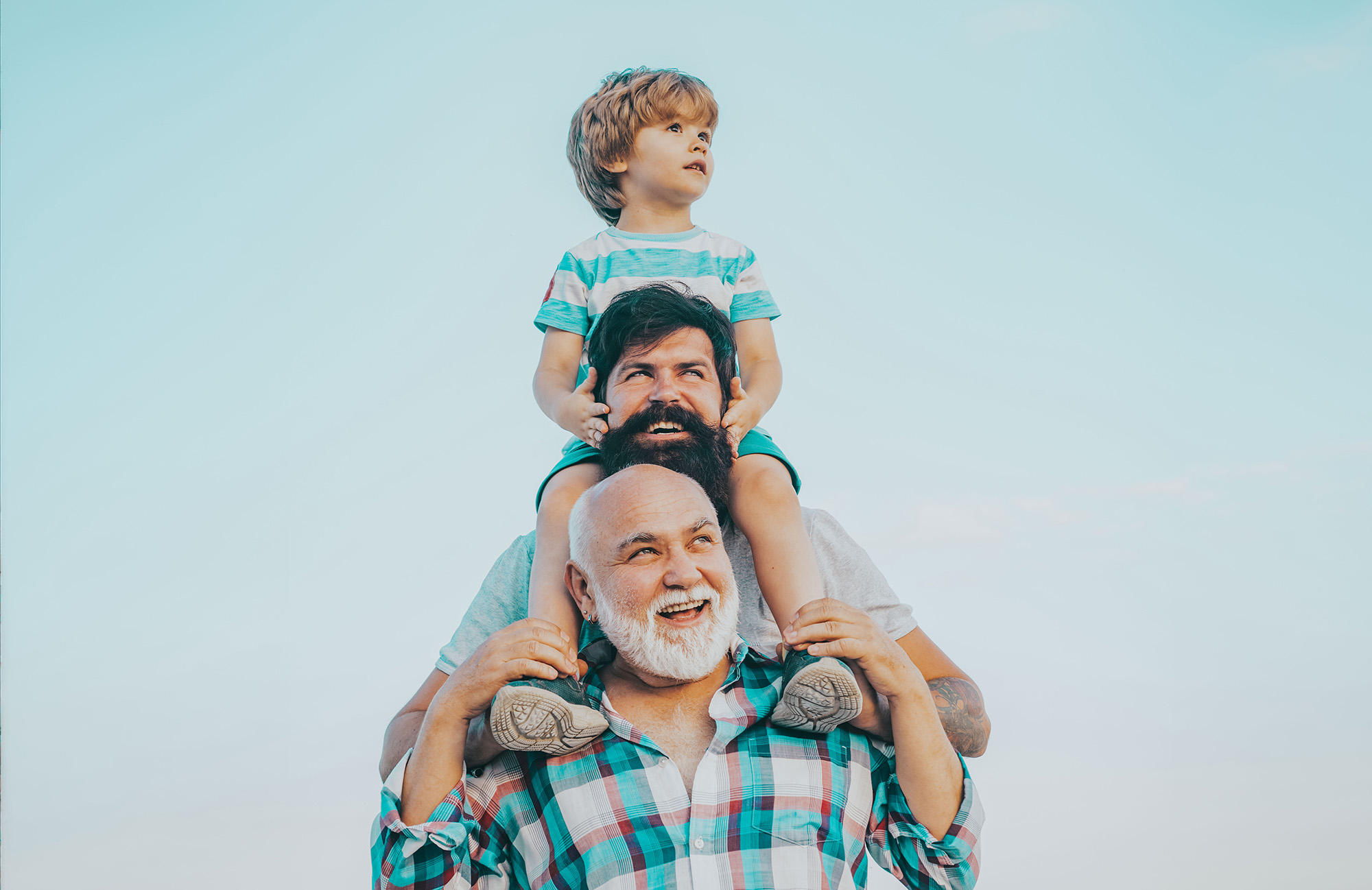 Men Generation: Grandfather Father And Grandson Are Hugging Look